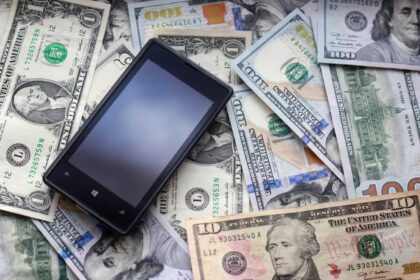 Instant sign-up bonus, phone sitting on pile of money