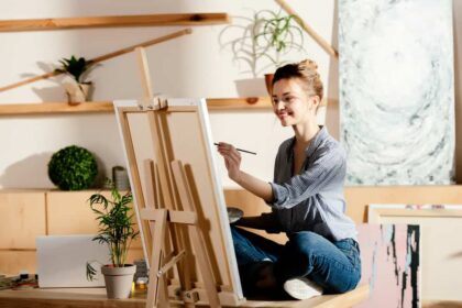 Creative ways to make money, Woman working on canvas painting.