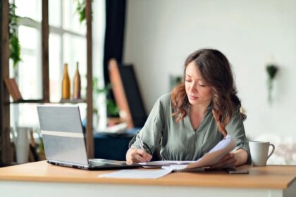 A woman entrepreneur working from home on her side business.