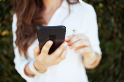 A woman using her smartphone to shop online.