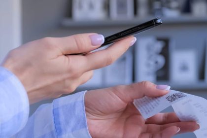 Scan Receipts For Money, woman scanning her receipt for cashback rewards
